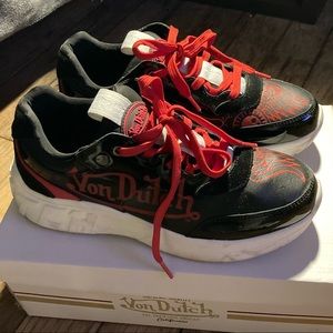 Von Dutch red and black low top runners.